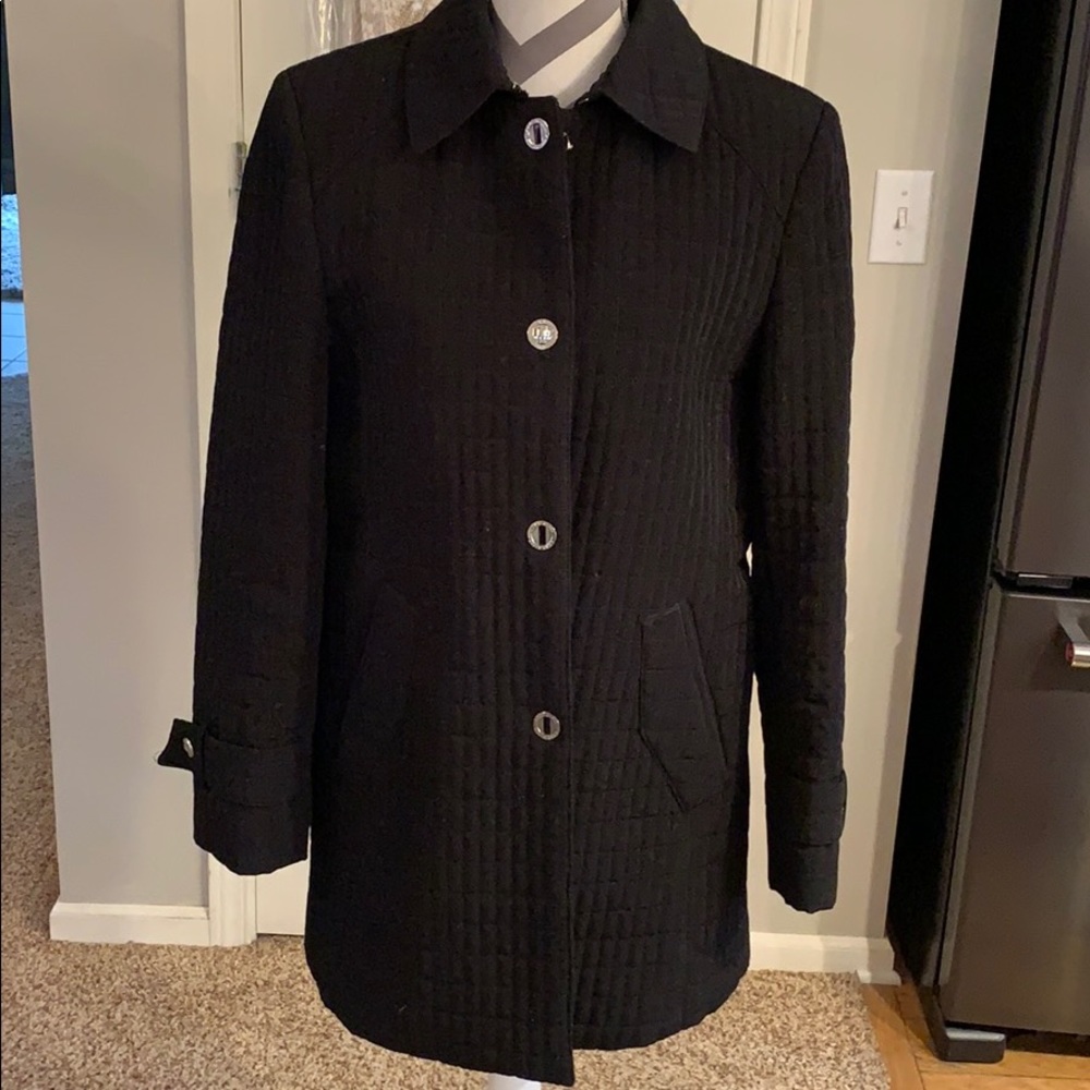 Quilted black coat embellished with silver buttons